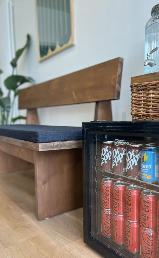 The bench and drinks fridge at TINY's